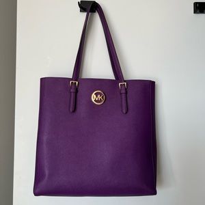 Michael Kors purse in berry purple.